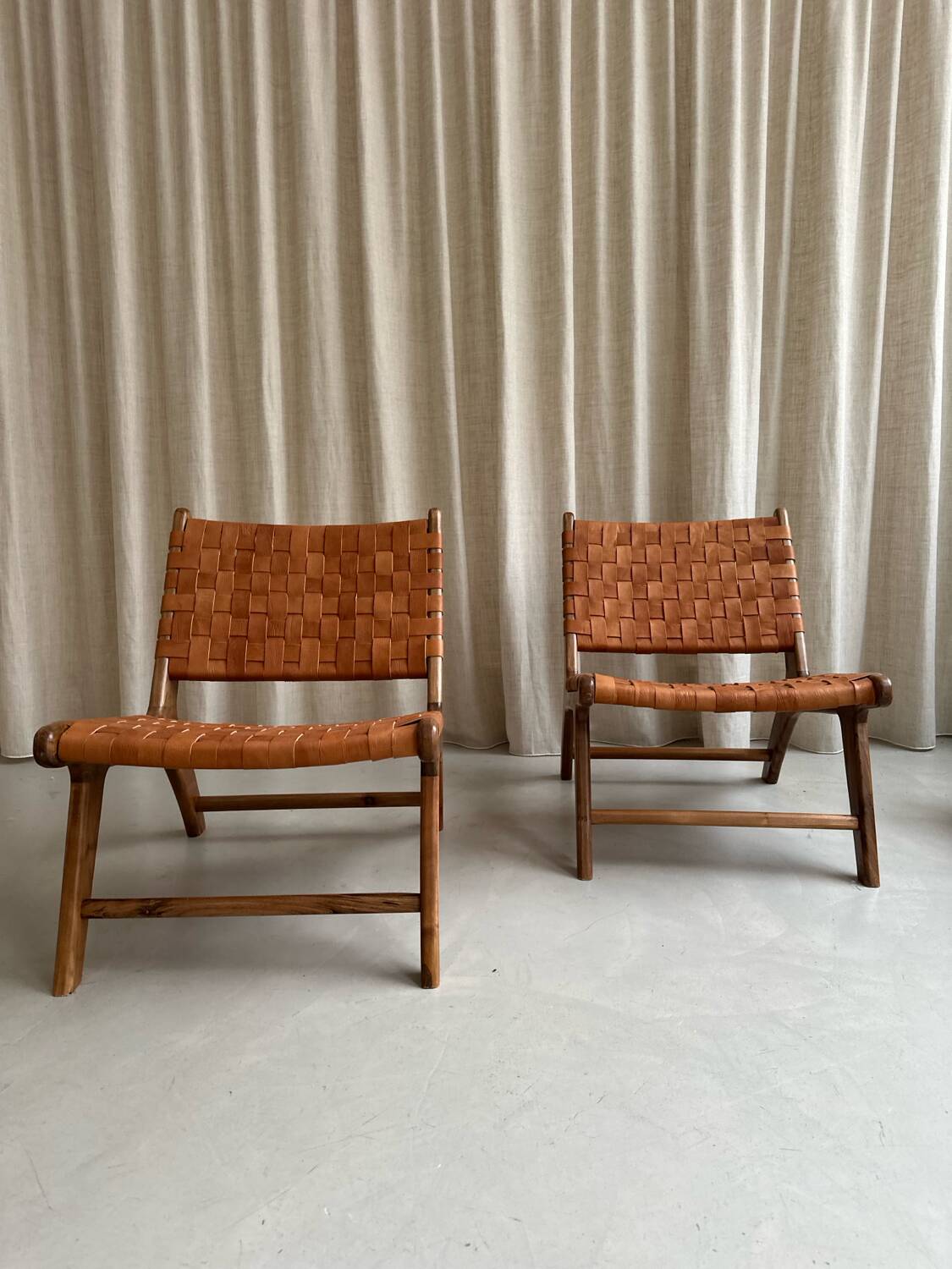 Pair of leather and walnut armchairs
