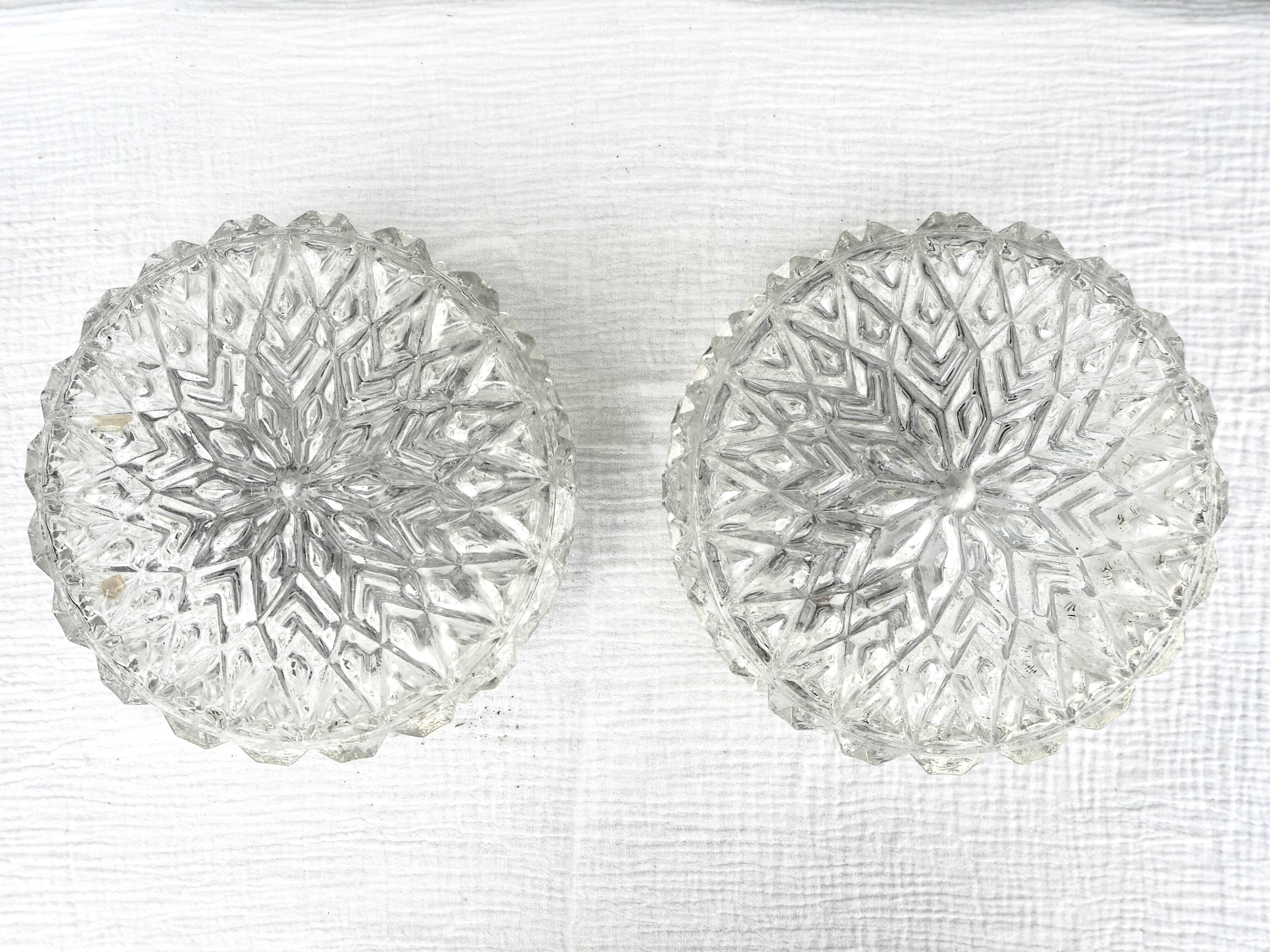 Pair of round ceiling lights in chiseled glass