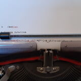 Portable, functional typewriter with user manual