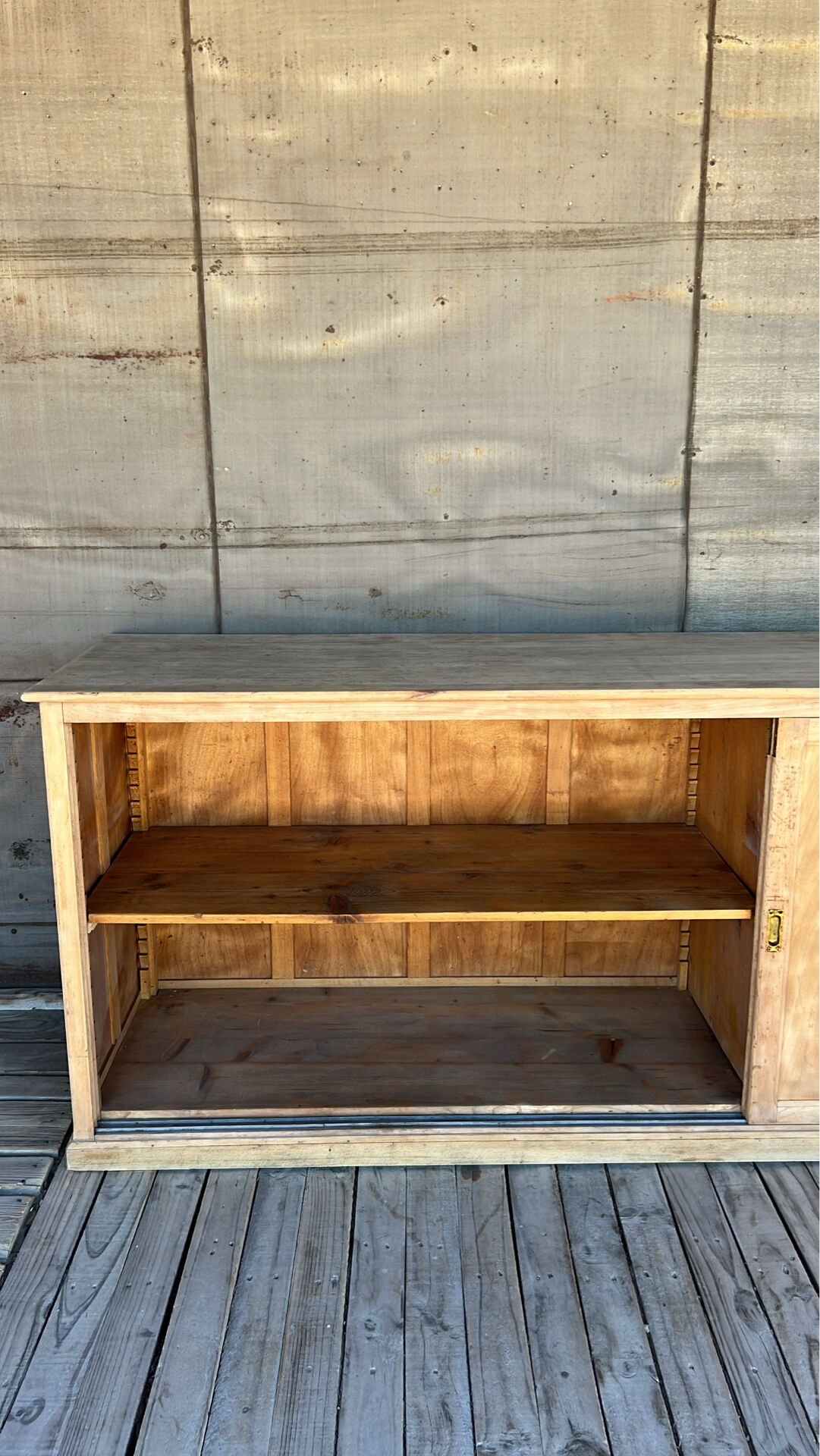 Old counter with sliding doors in raw wood