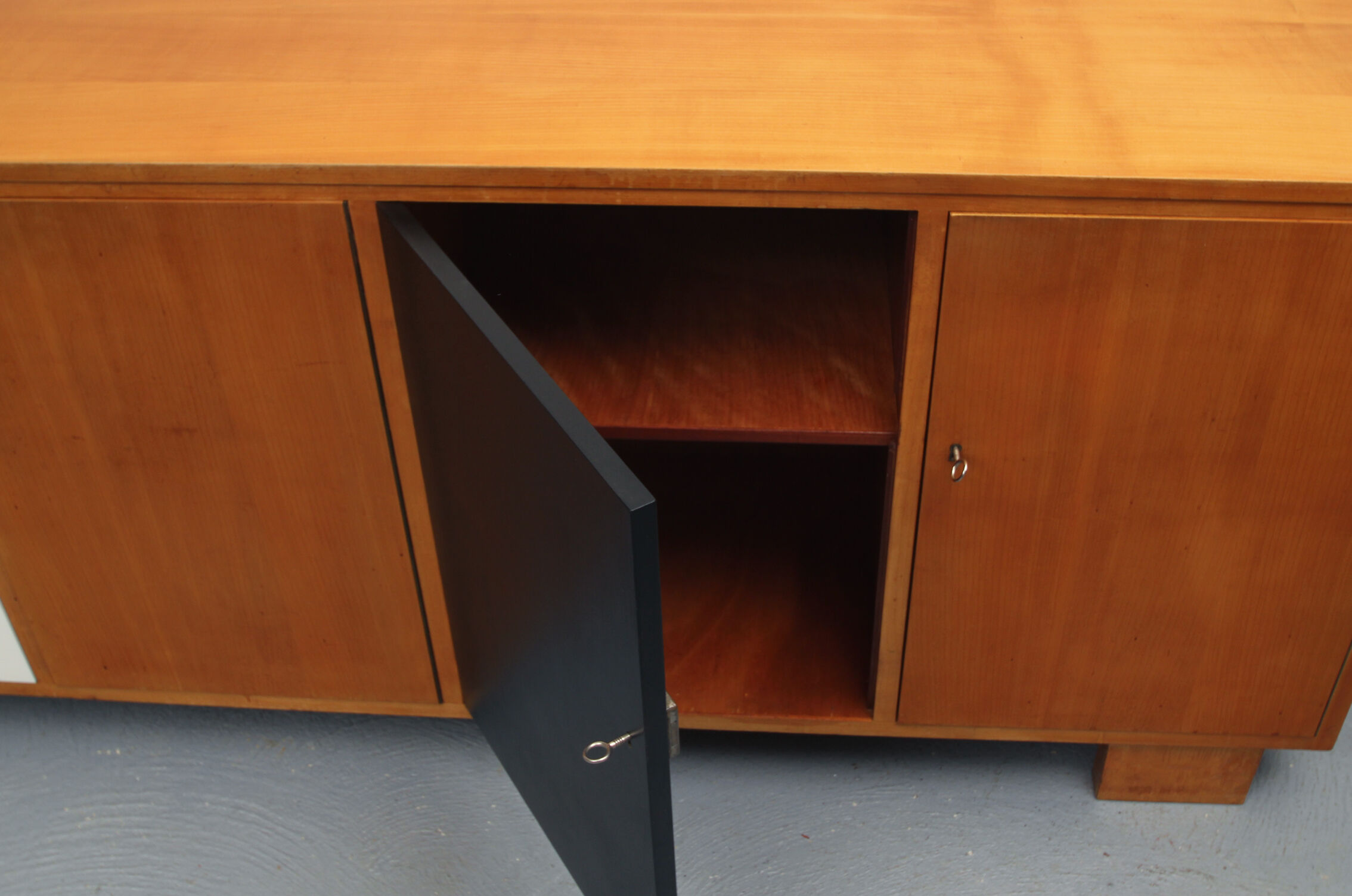 Sideboard in cherrywood with black and white doors 1950s