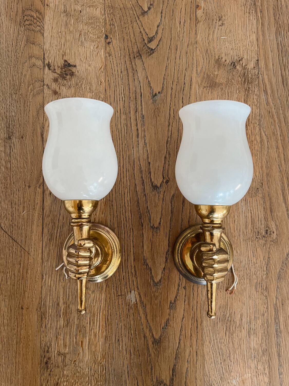Set of 2 golden, bronze and brass torch wall lights