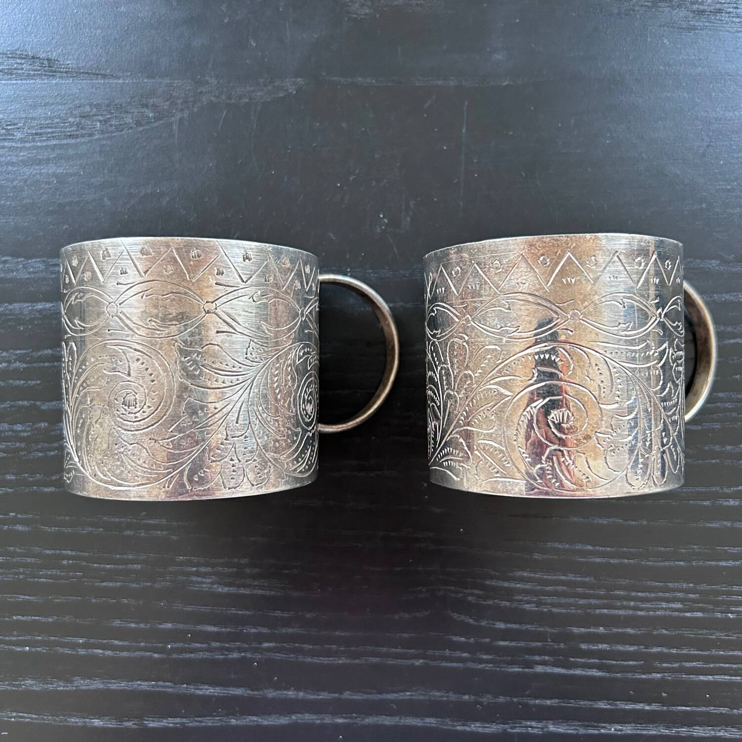 Pair of chiseled silver cups