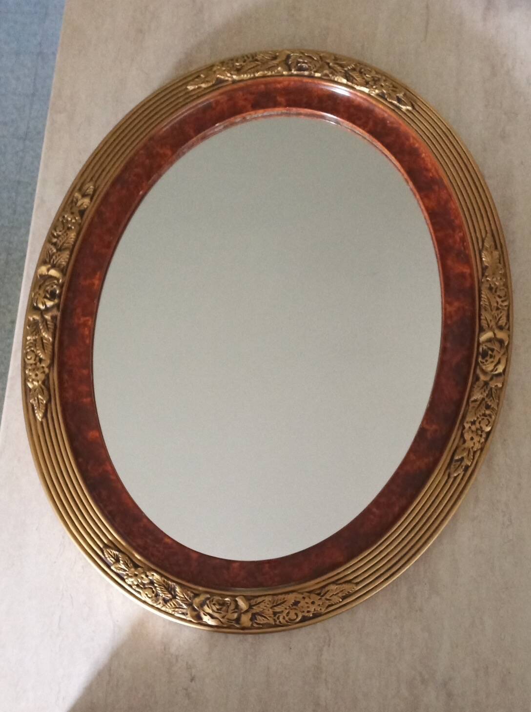 Modern oval mirror with flower decoration