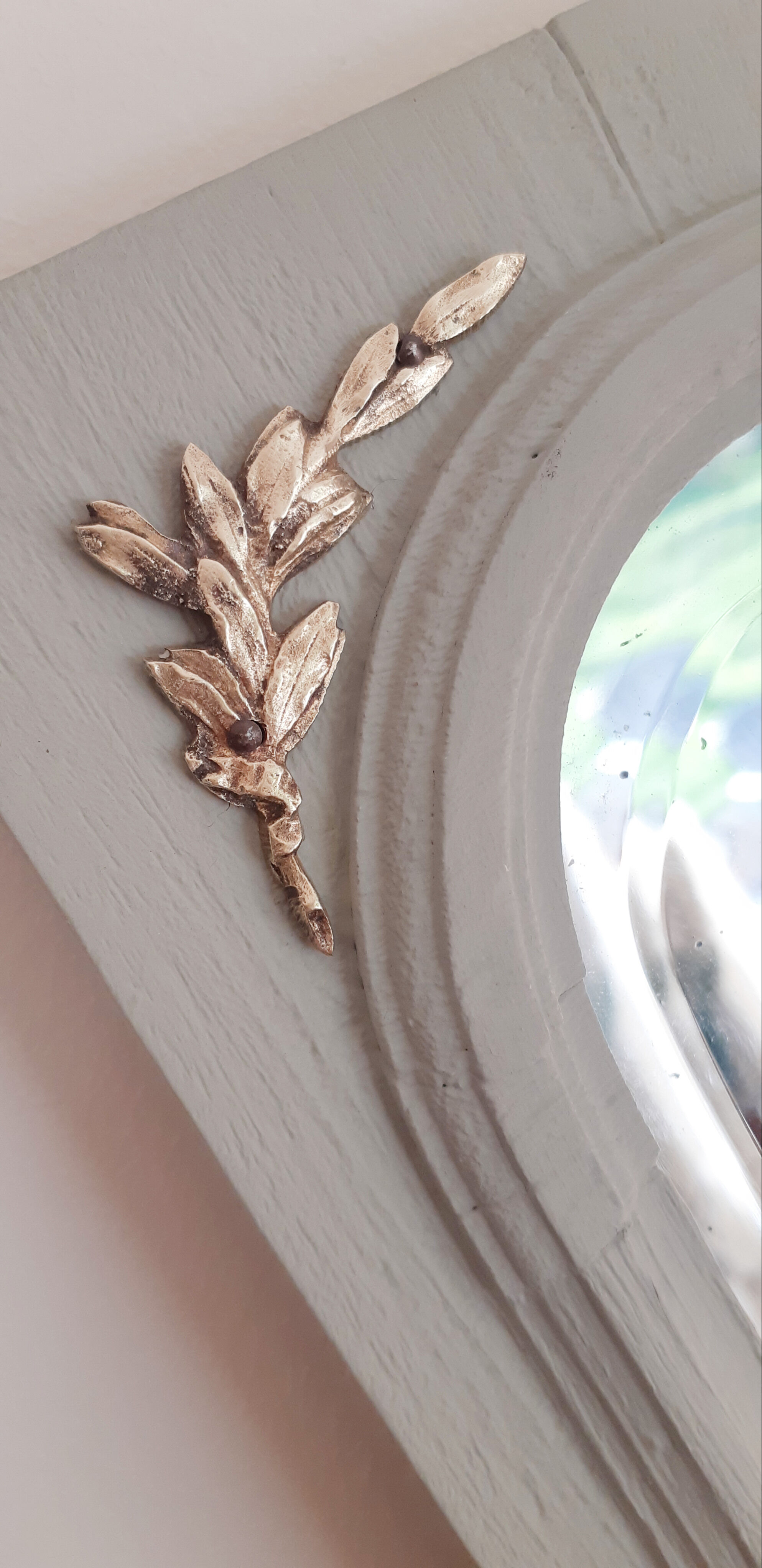 Old mirror patinated green of gray