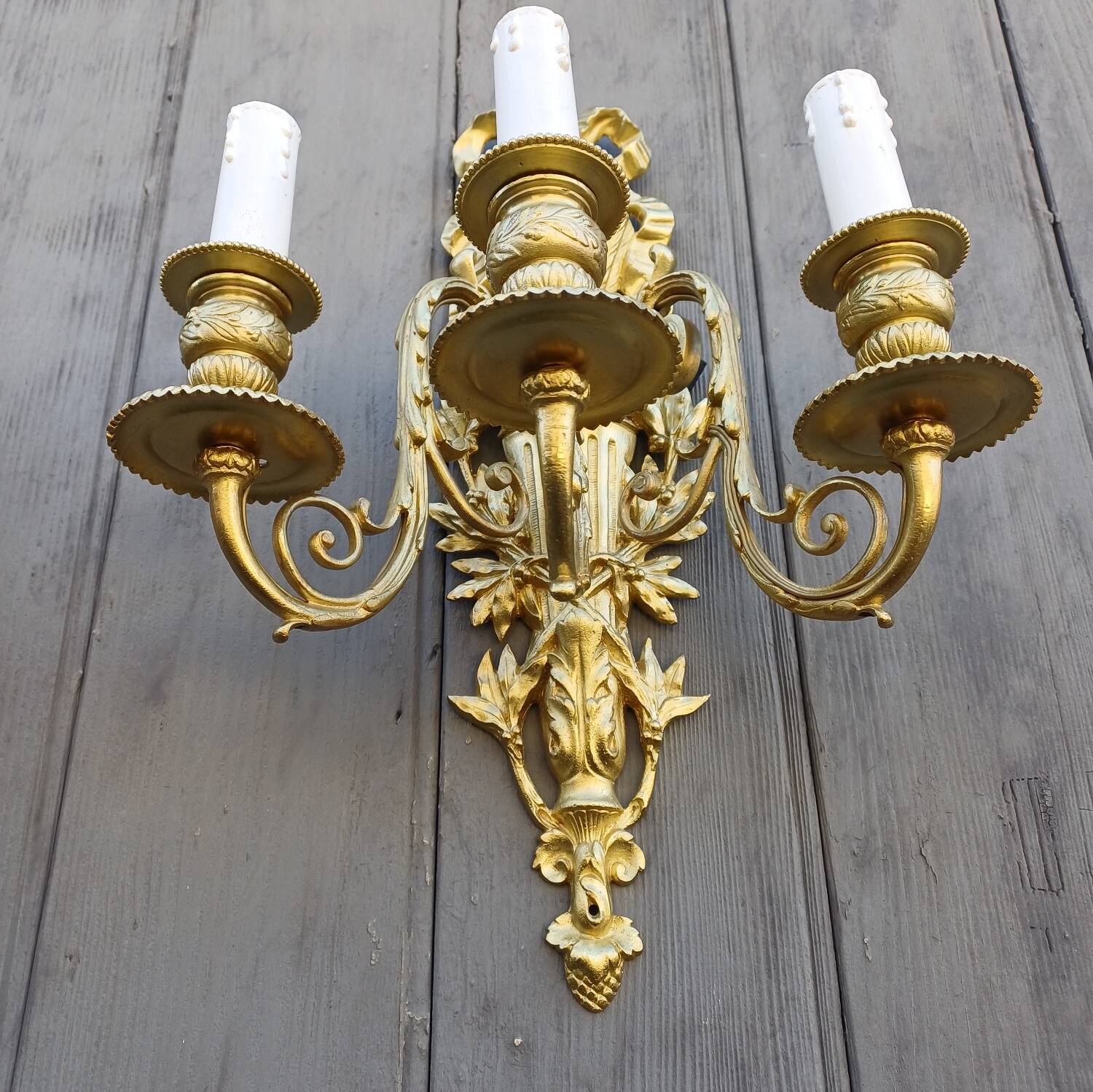 Pair of antique bronze wall sconces from the Napoleonic III era in the Louis XVI style.