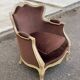 Louis XV cabriolet armchair in solid wood, beige with brown velvet fabric.