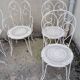 Wrought iron garden furniture from the early 20th century.