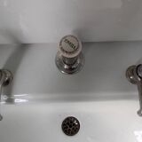 Set of a sink and its retro ceramic splashback.