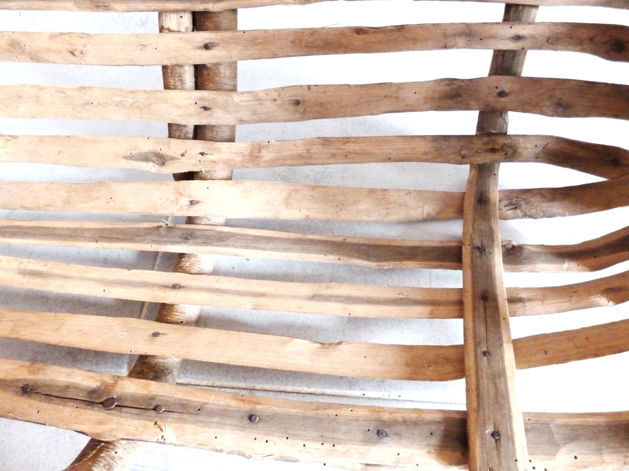 Old wooden harvest basket, slatted wooden basket, folk art.
