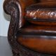 Two-seater canapé in aged leather, Victorian style.