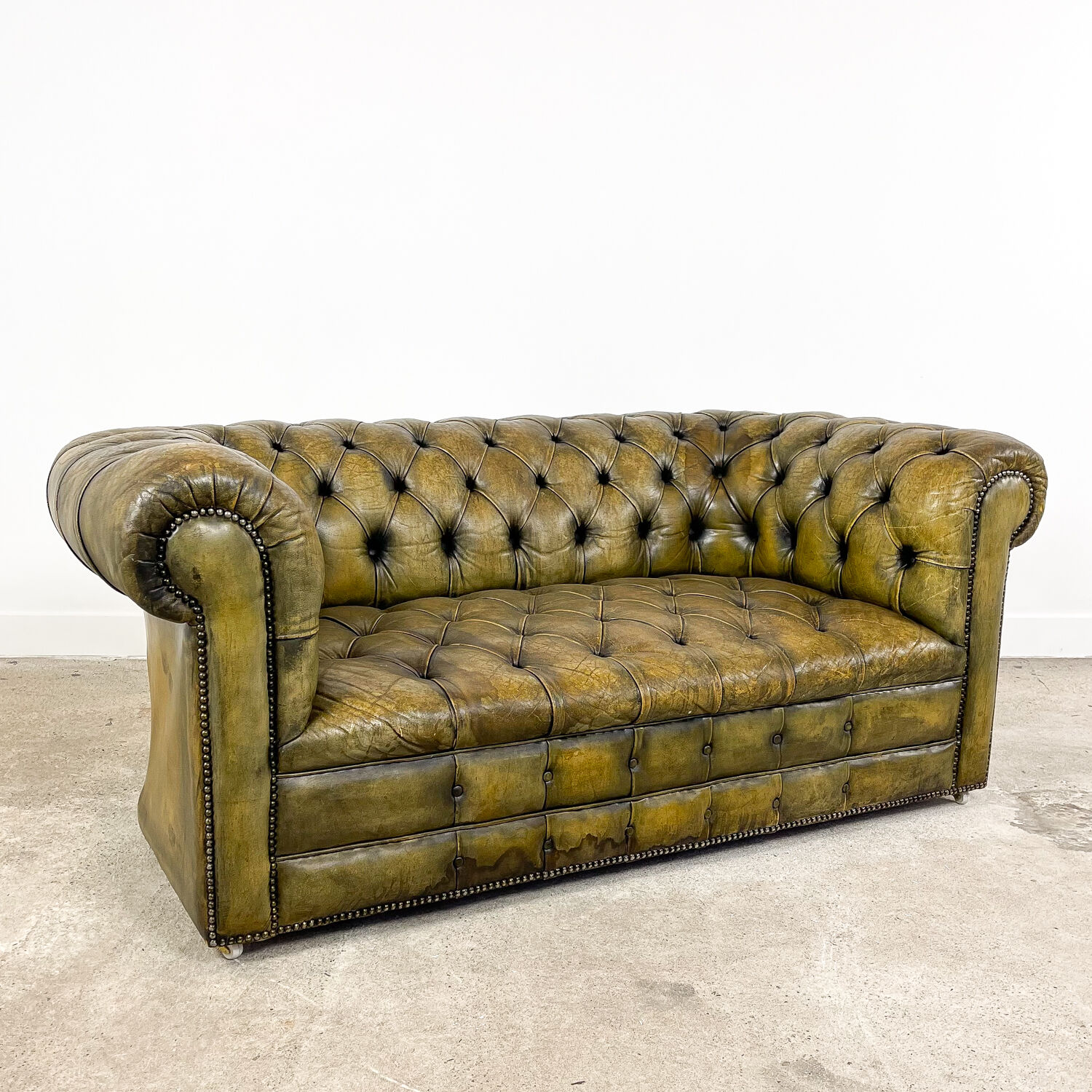 Old vintage leather chesterfield sofa