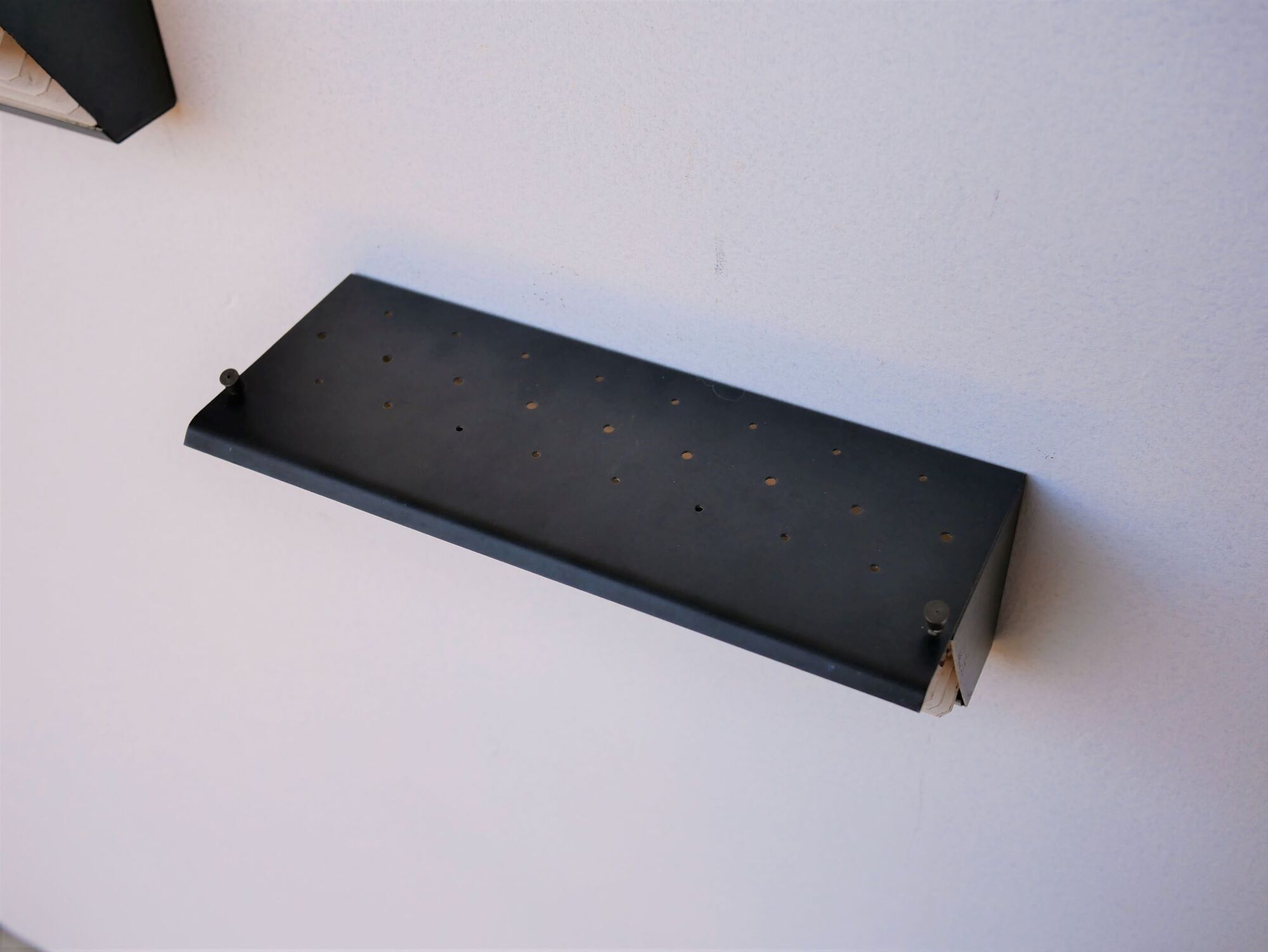 Pair of modernist metal wall light model 212, by Jacques Biny for Luminalite