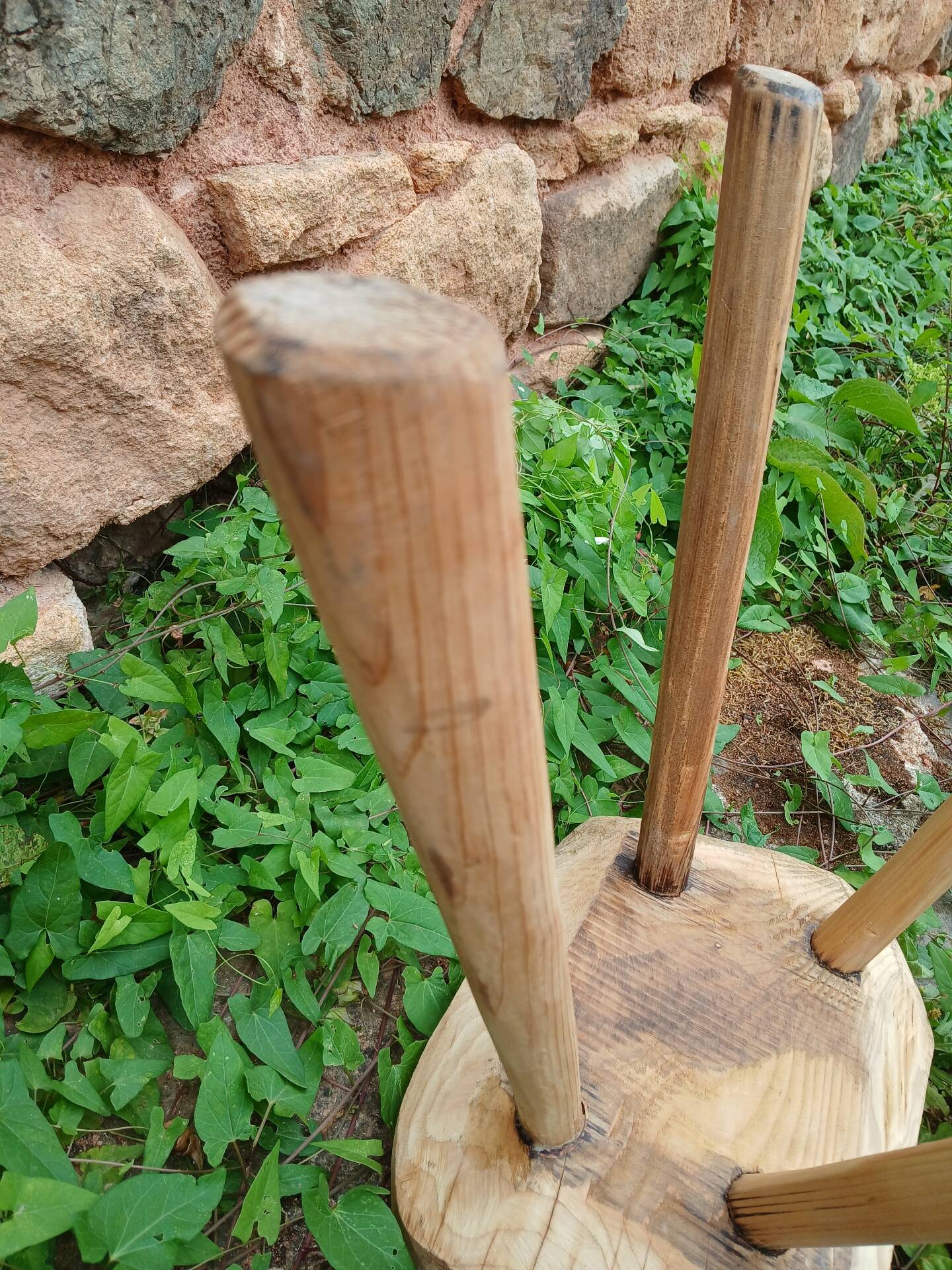 Antique stool in raw wood