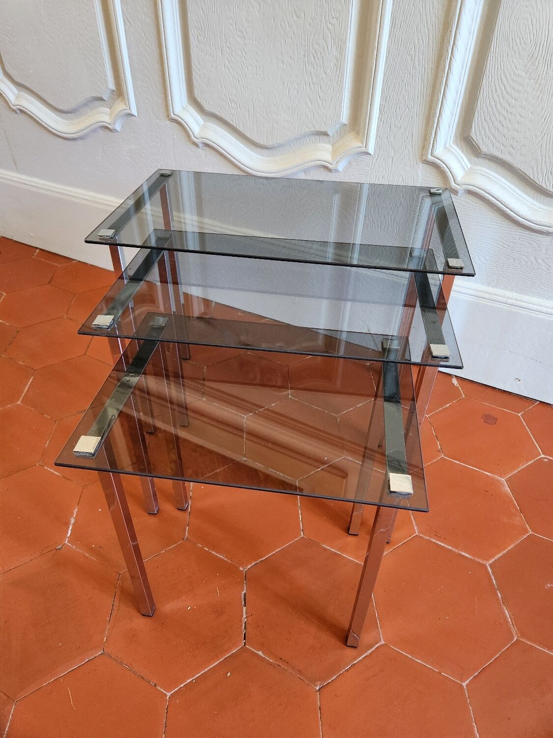 3 nesting tables from the 1970s in smoked glass.