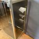 Chrome-plated brass display cabinet with smoked glass.