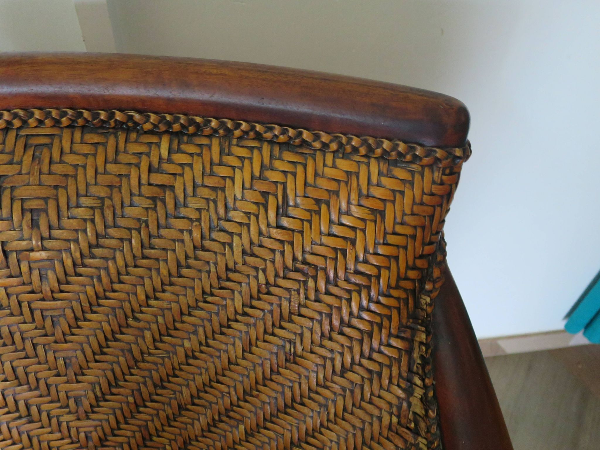 Woven rattan armchair and exotic wood in colonial style, 1980s.