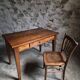 Old French table in cherry wood with bistro chair, circa 1900–1930.