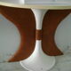 White lasked wood console and 1980s skai background