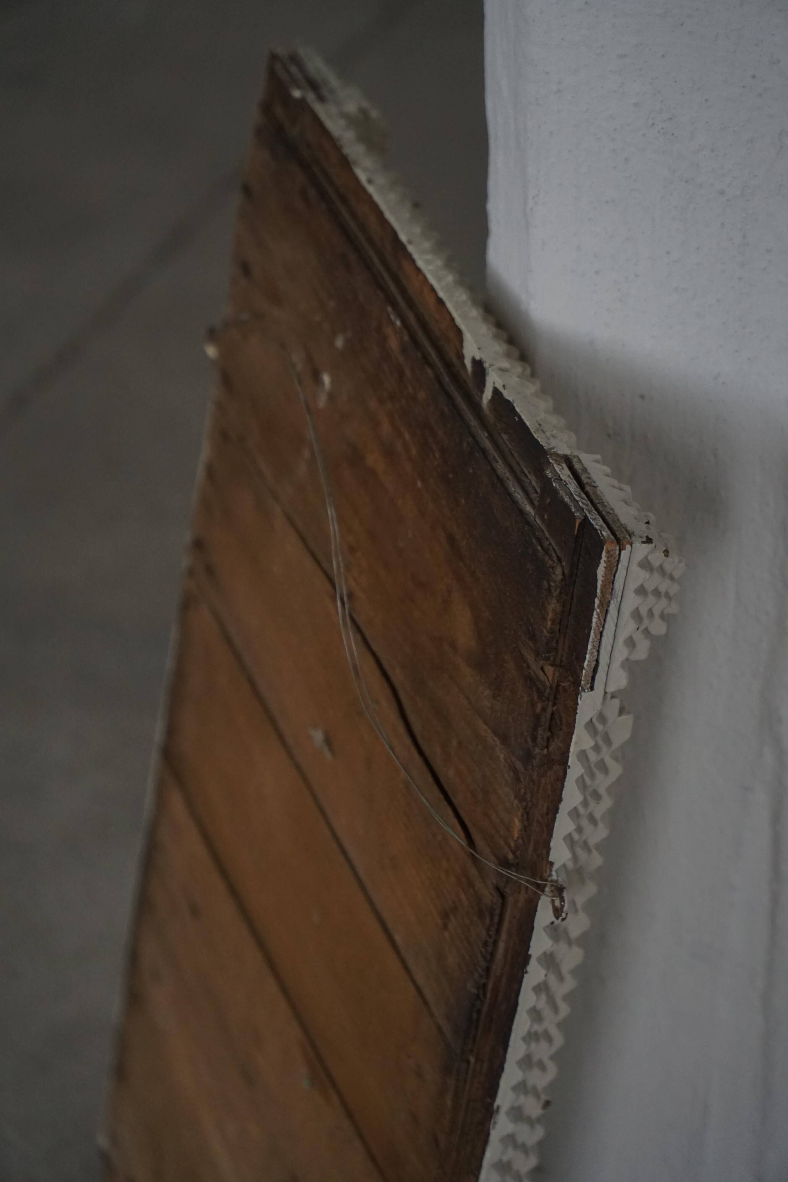 Wall mirror in tramp art style, hand-carved with a painted white frame, early 1900s.