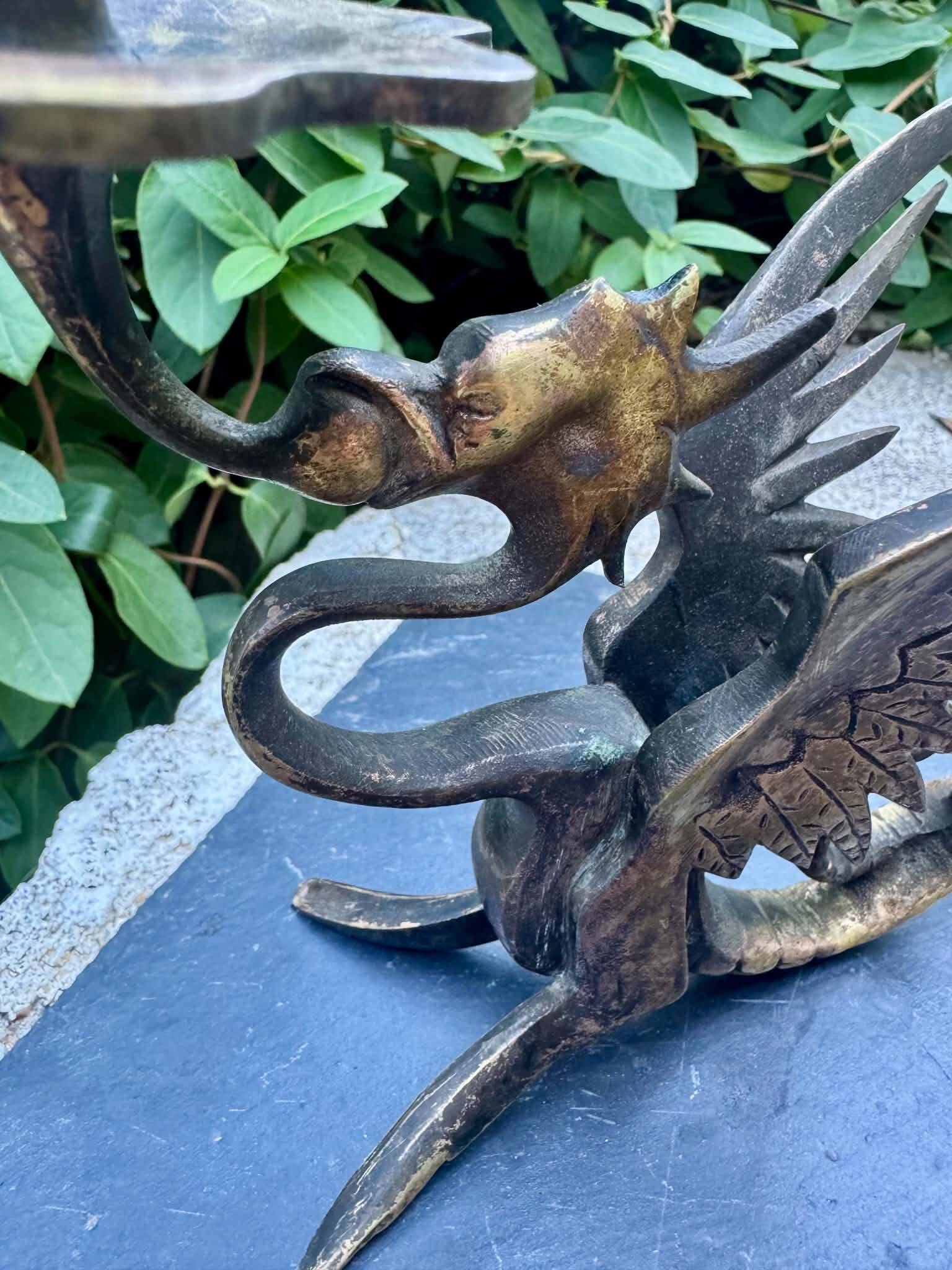 Pair of chimera candle holders in bronze, 19th century.