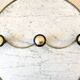 silver and black metal coat hook from the 70s