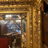 Mirror in wood and gilded stucco