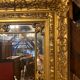 Wooden mirror with gilded stucco
