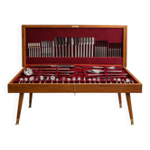 Modernist cutlery set in its wooden cabinet, 130 stainless steel pieces, 1960.