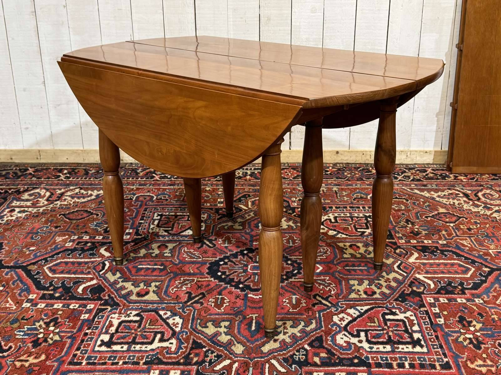 Round cherry wood table, 6 feet, Louis Philippe style with 2 extensions.