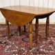 Round cherry wood table, 6 feet, Louis Philippe style with 2 extensions.