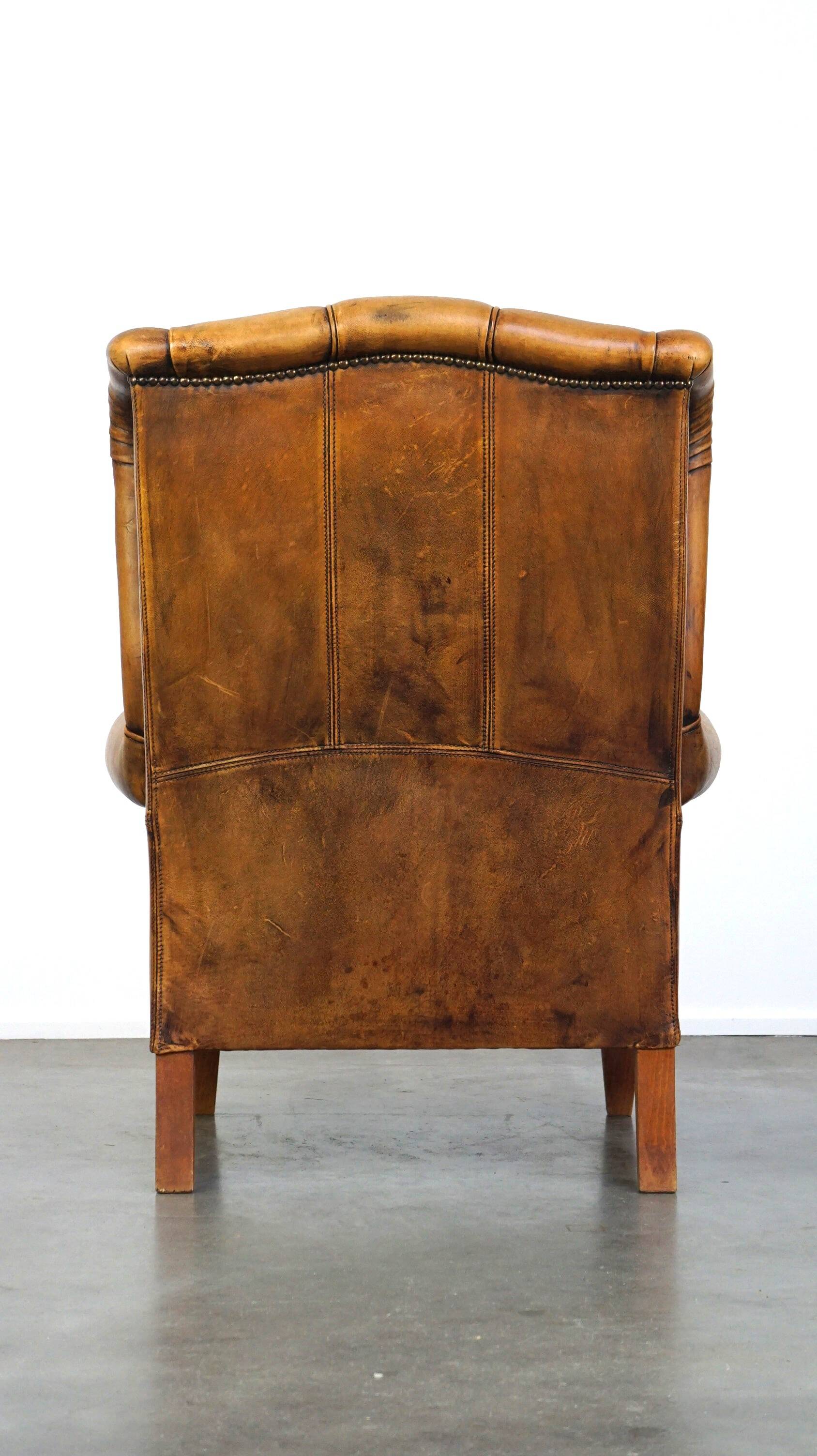 Sheepskin wingback chair with a unique design and a beautiful patina