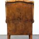 Sheepskin wingback chair with a unique design and a beautiful patina