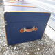 Old blue travel trunk handle leather