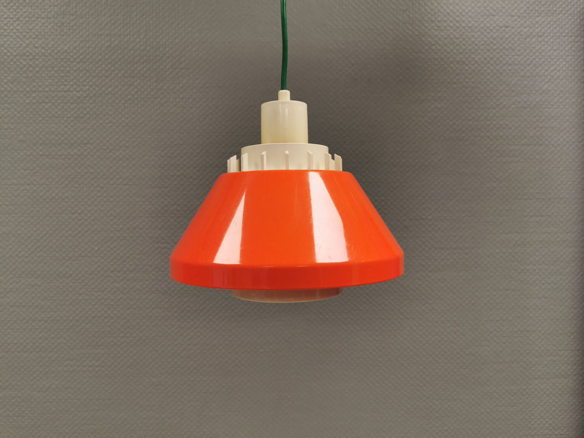 An orange pendant lamp made from hard-pressed ABS plastic. Denmark 1970s