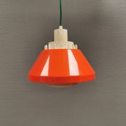 An orange pendant lamp made from hard-pressed ABS plastic. Denmark 1970s