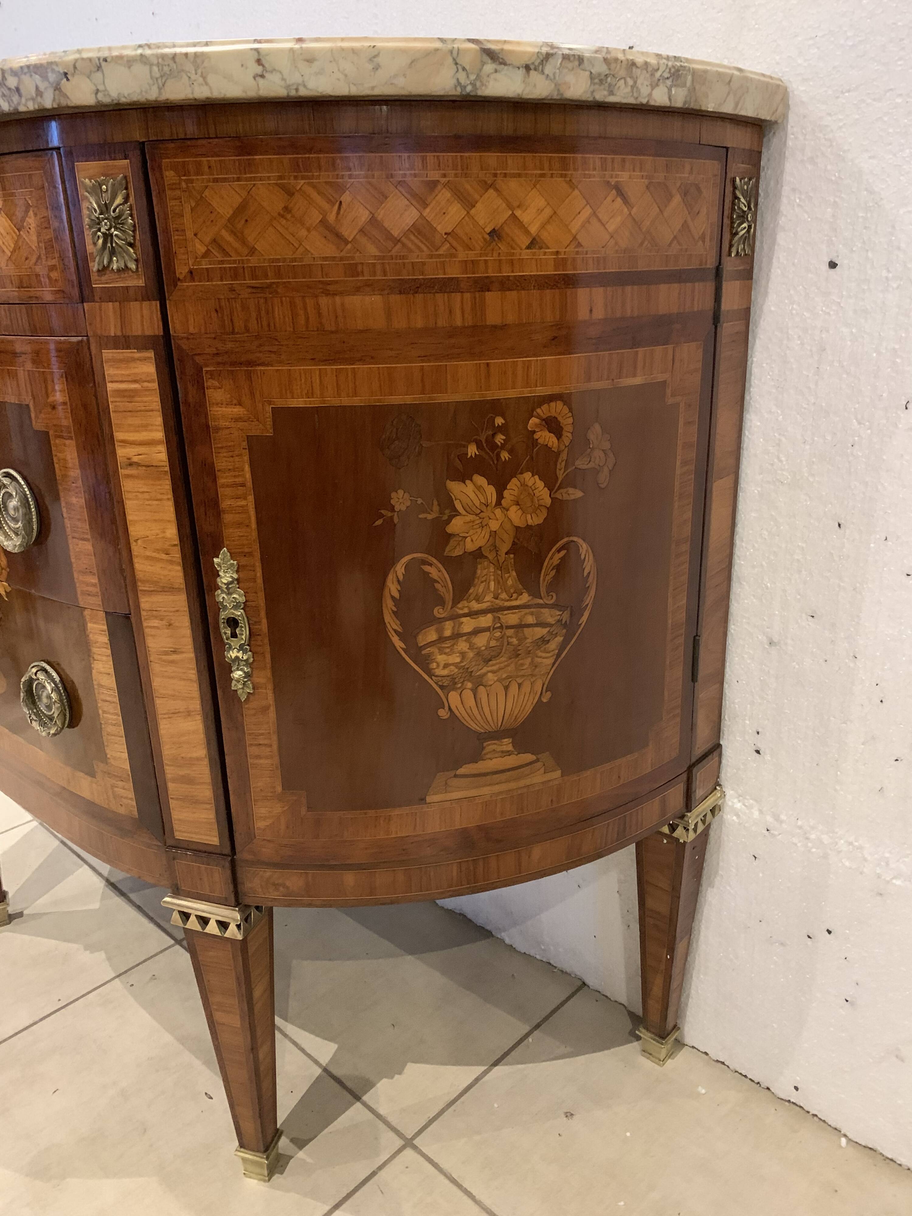 Louis XVI style half-moon chest of drawers in late nineteenth century marquetry