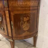 Louis XVI style half-moon chest of drawers in late nineteenth century marquetry