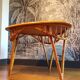 Table basse vintage tripode en rotin