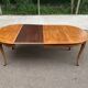Round extendable dining table Louis XV in solid wood from the 1960s.