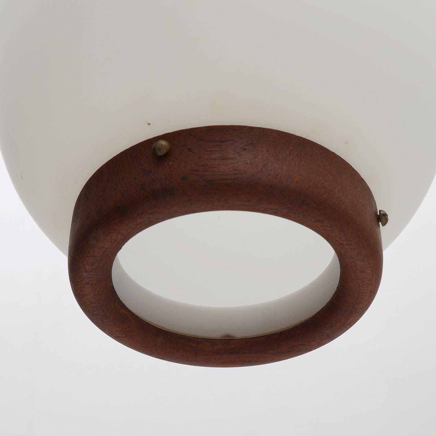 Bent Karlby "China" pendant lights, 3 lights, teak and glass, Lyfa, Denmark, 1960.