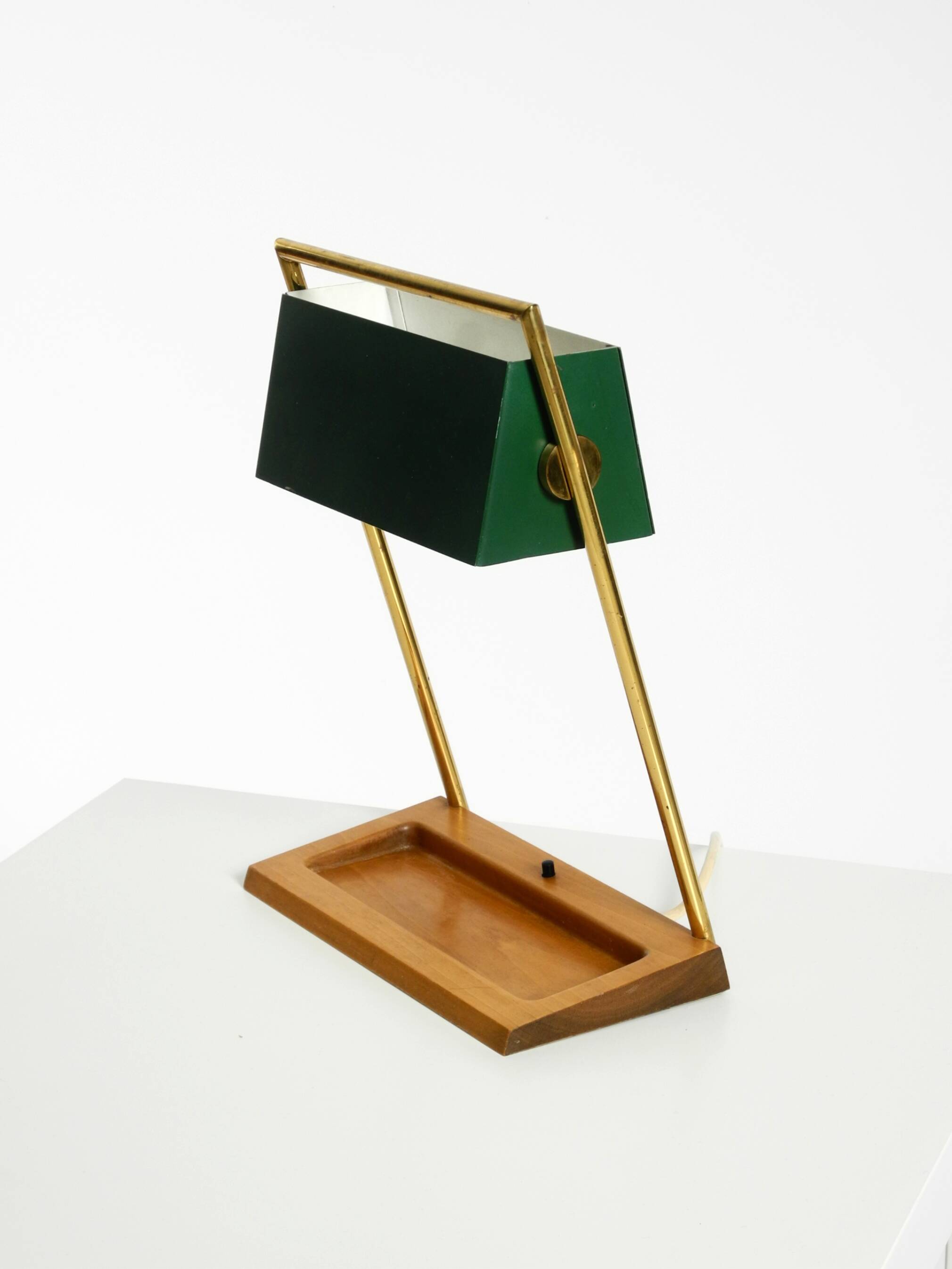 1960s Temde table lamp with a brass frame, teak base, and green lampshade