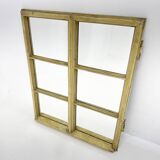 Vintage wooden window converted to a mirror
