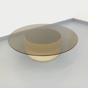 Vintage round coffee table in glass, leather, and metal in Space Age style from the 70s.