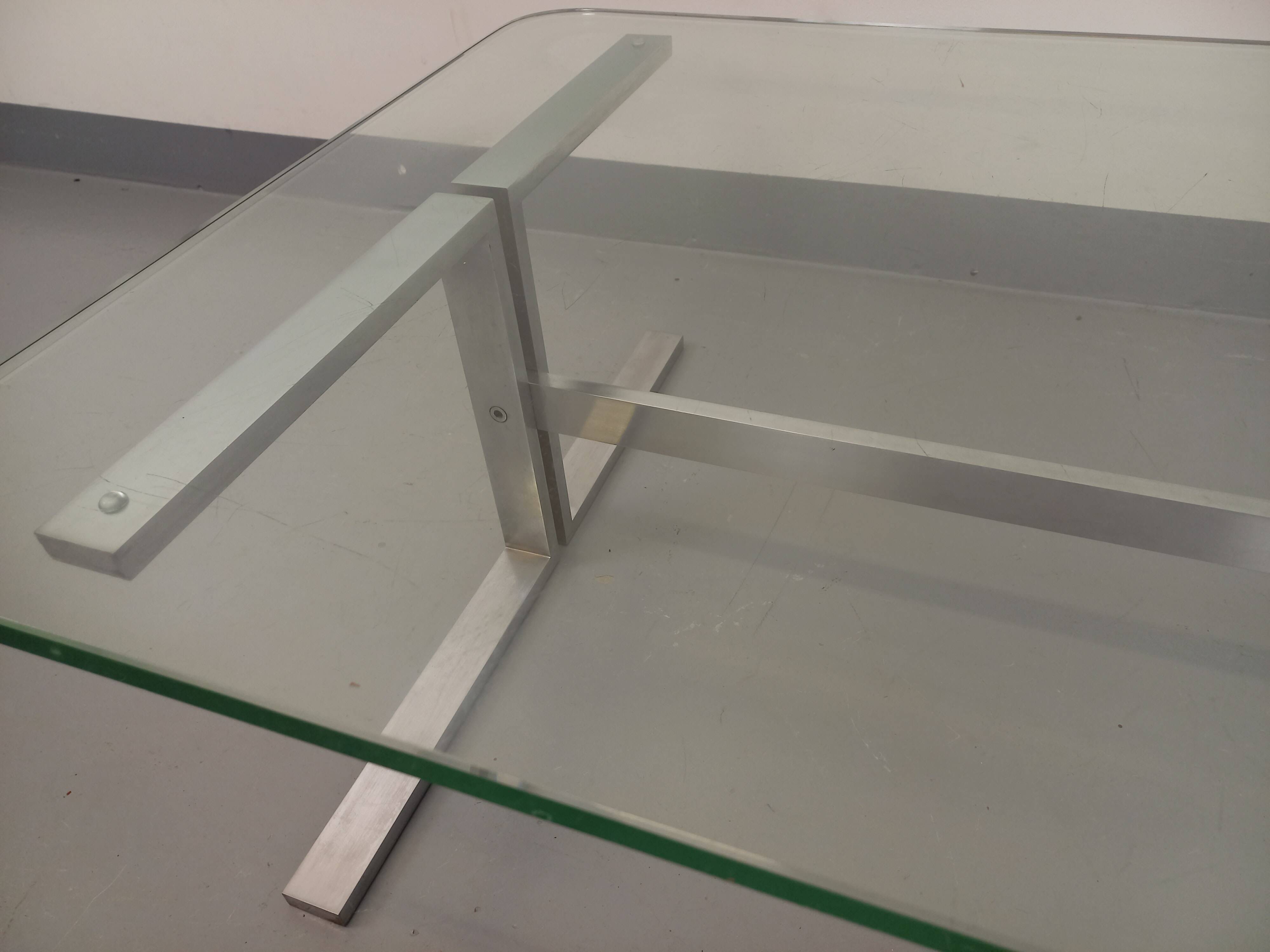 Vintage coffee table in transparent glass and cast aluminum from the 70s
