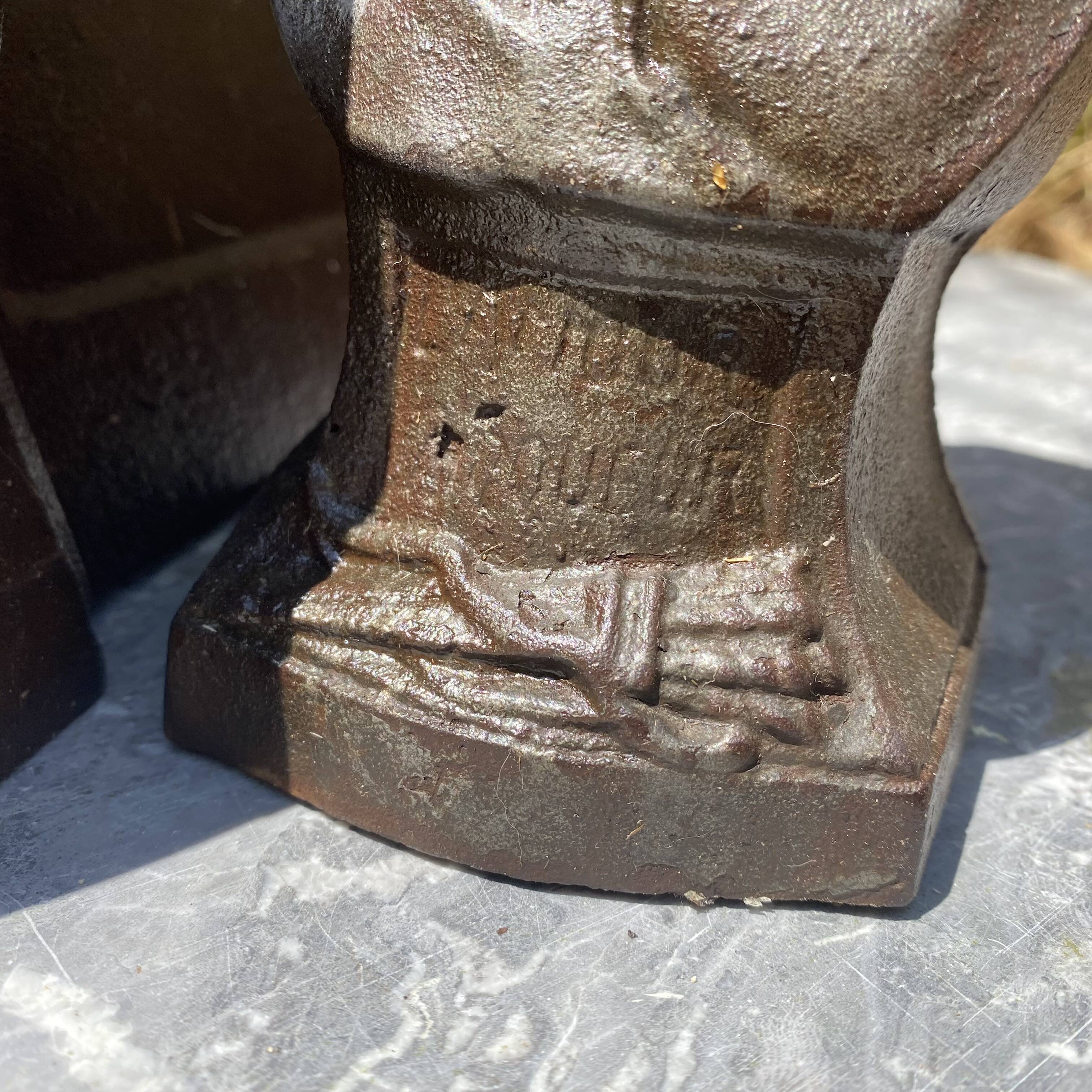 Pair of antique cast iron fire dogs "The Conquering Love"
