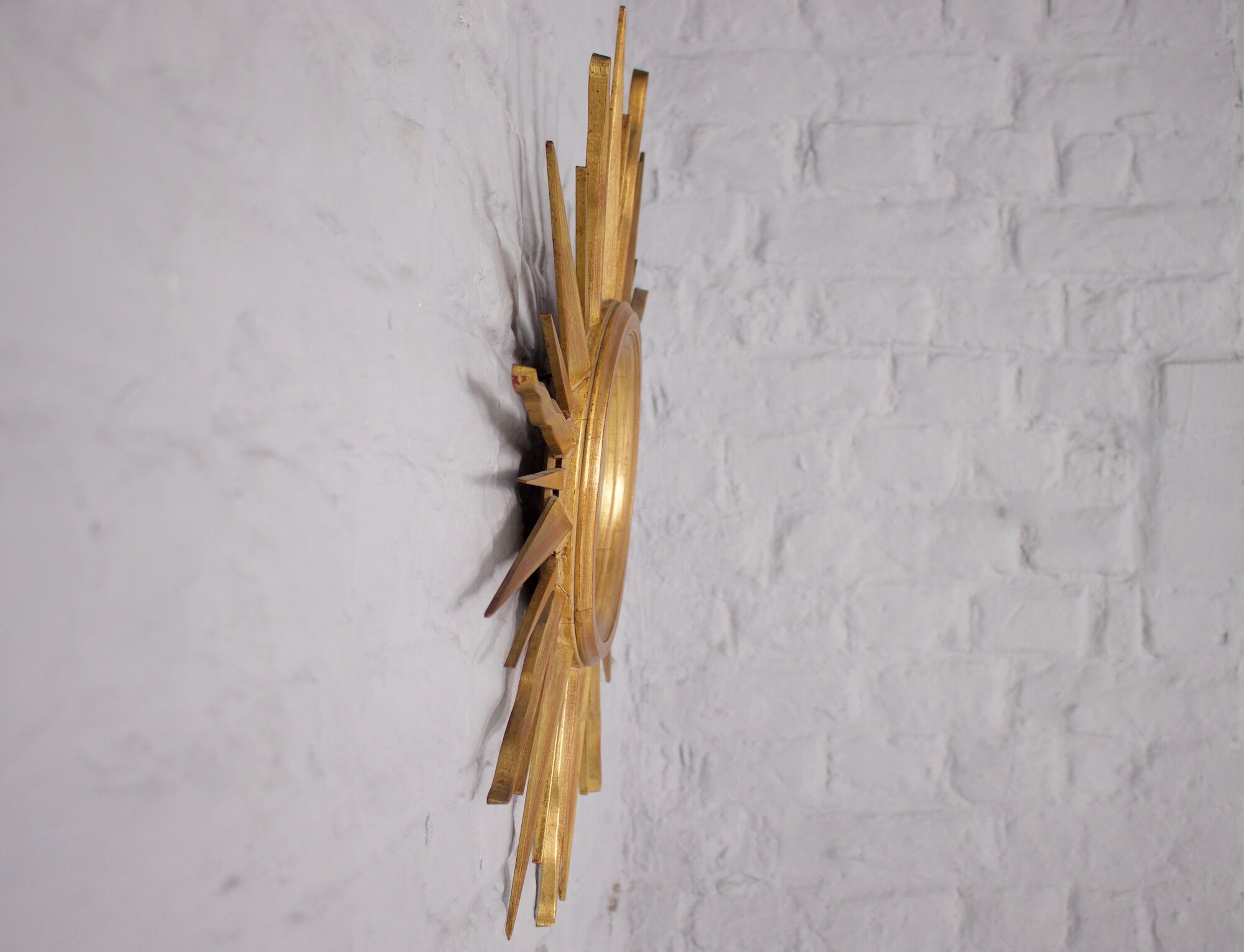 Sun mirror in gilded wood