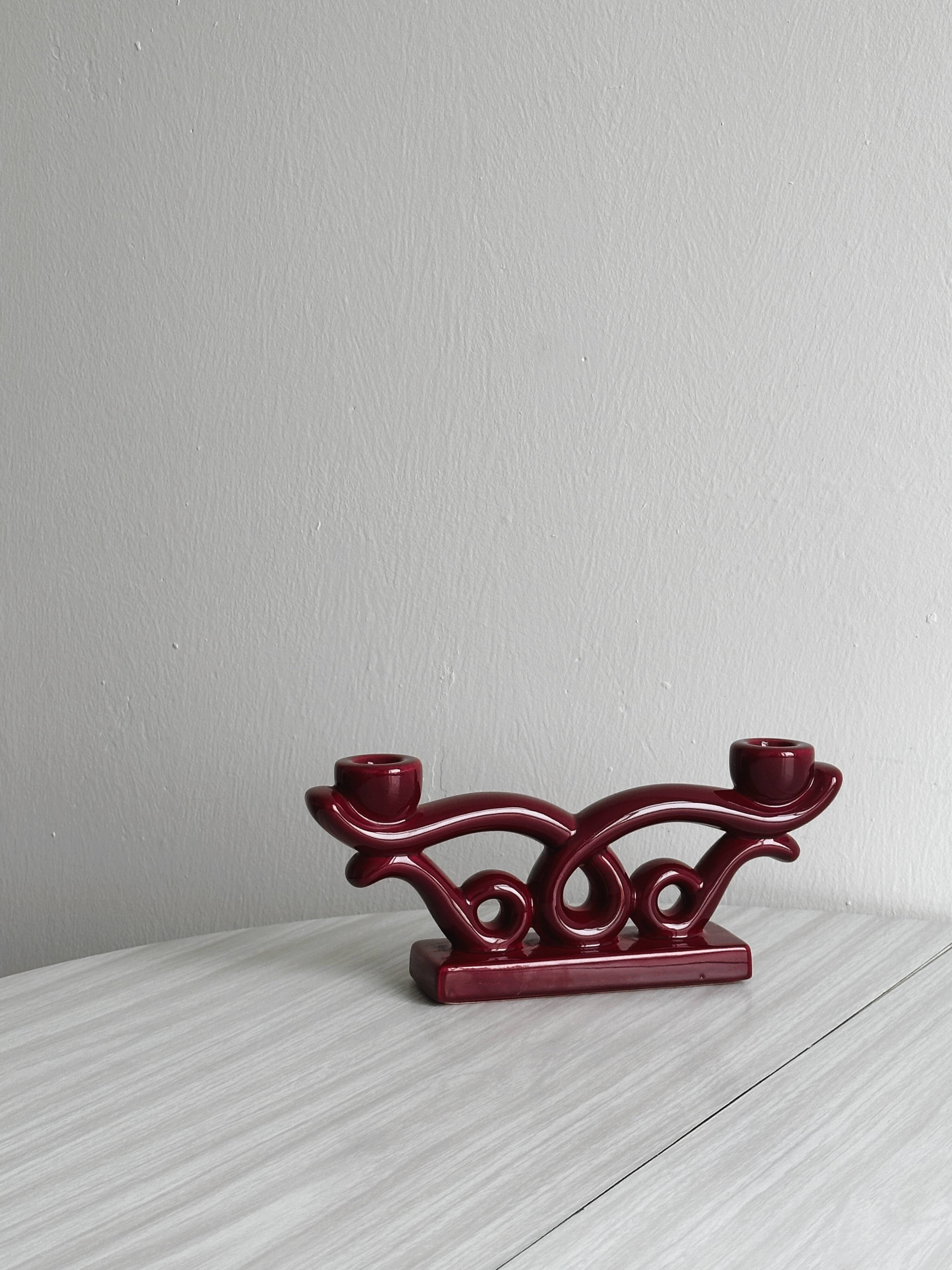 Vintage burgundy red ceramic candlestick