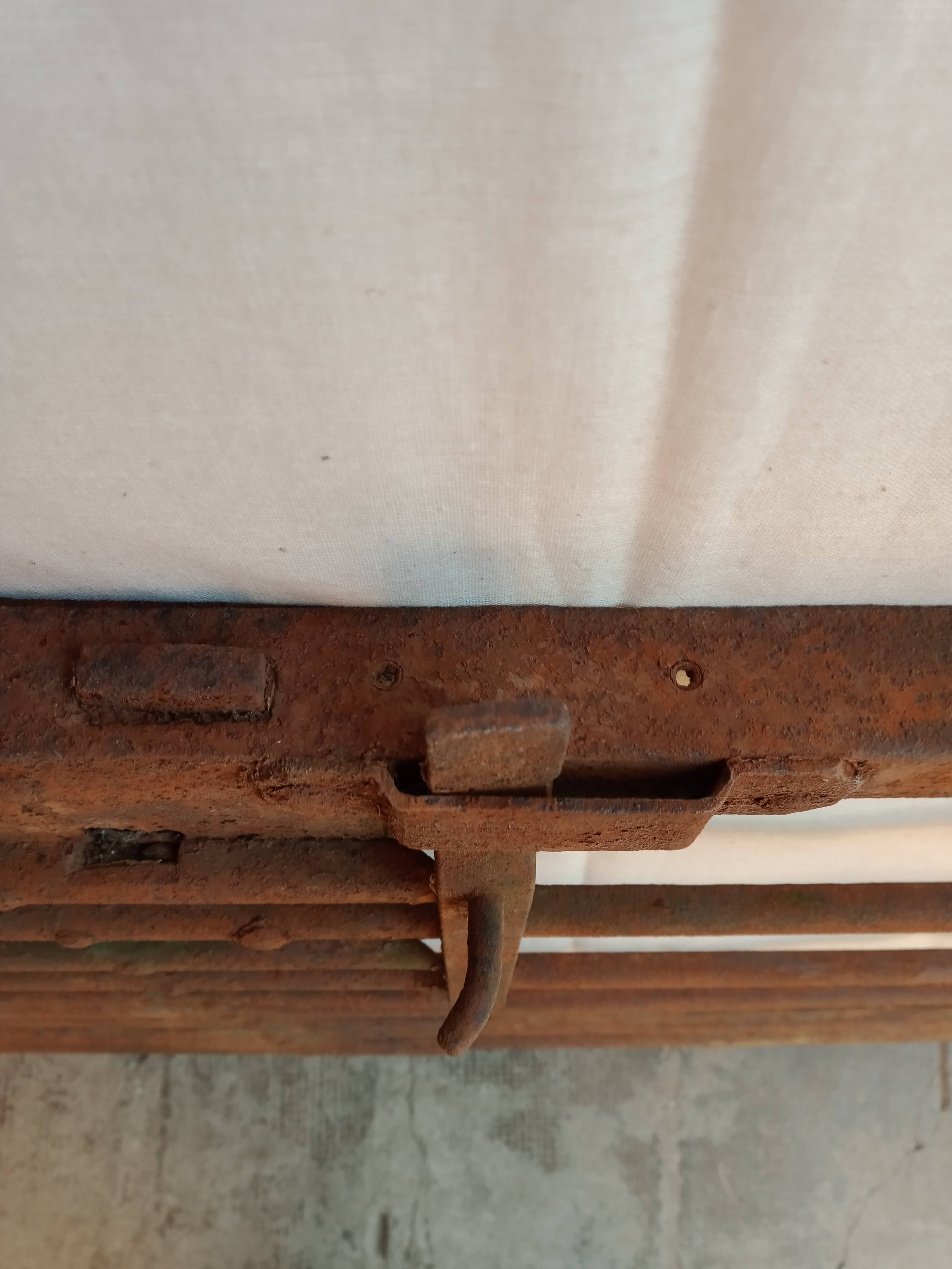 Old riveted metal gate