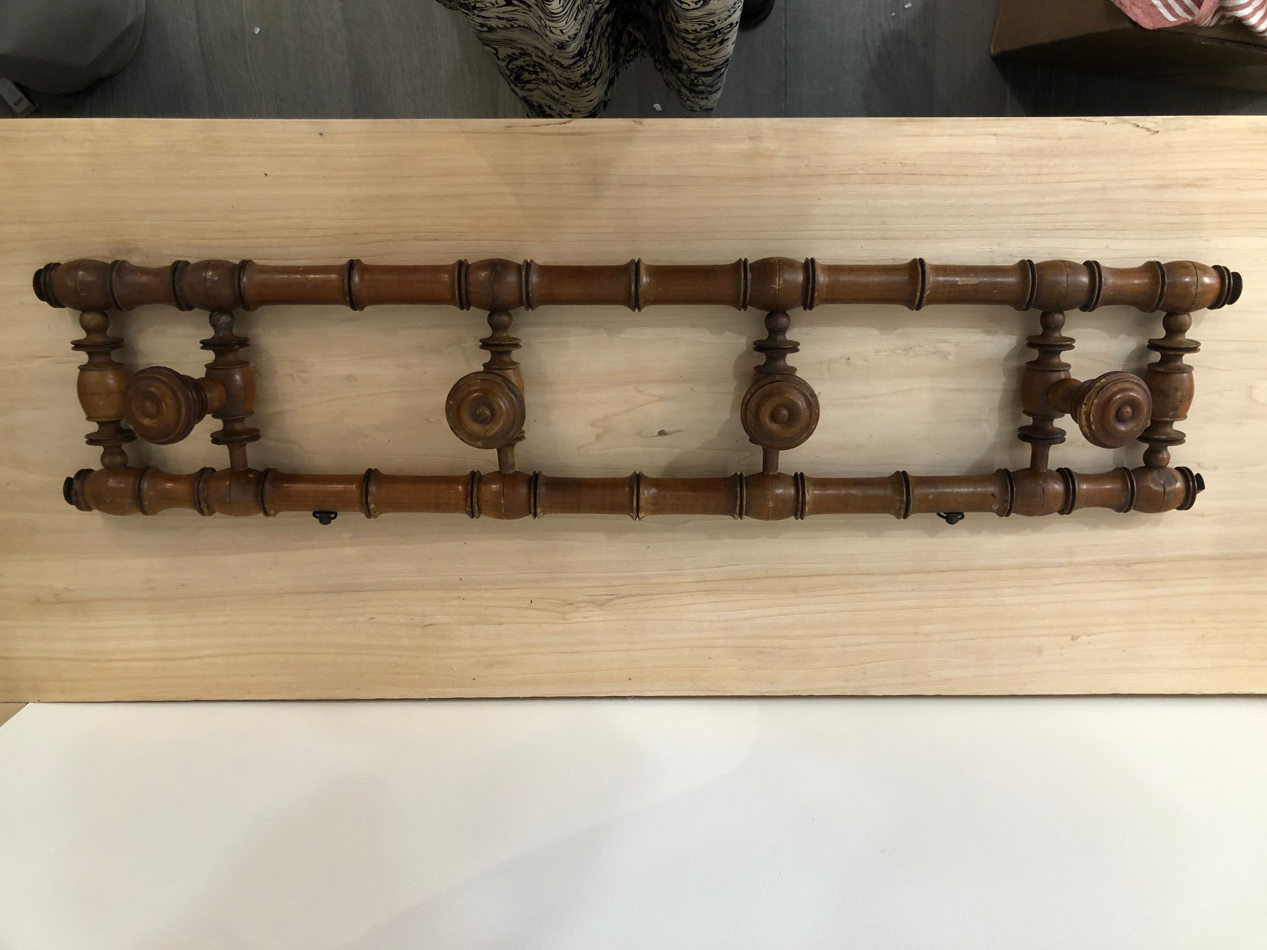 Wooden coat rack with swivel hooks
